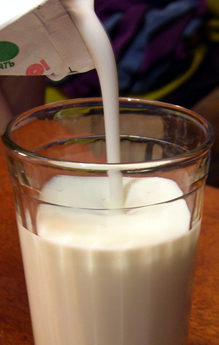 Fresh kefir being poured into a glass